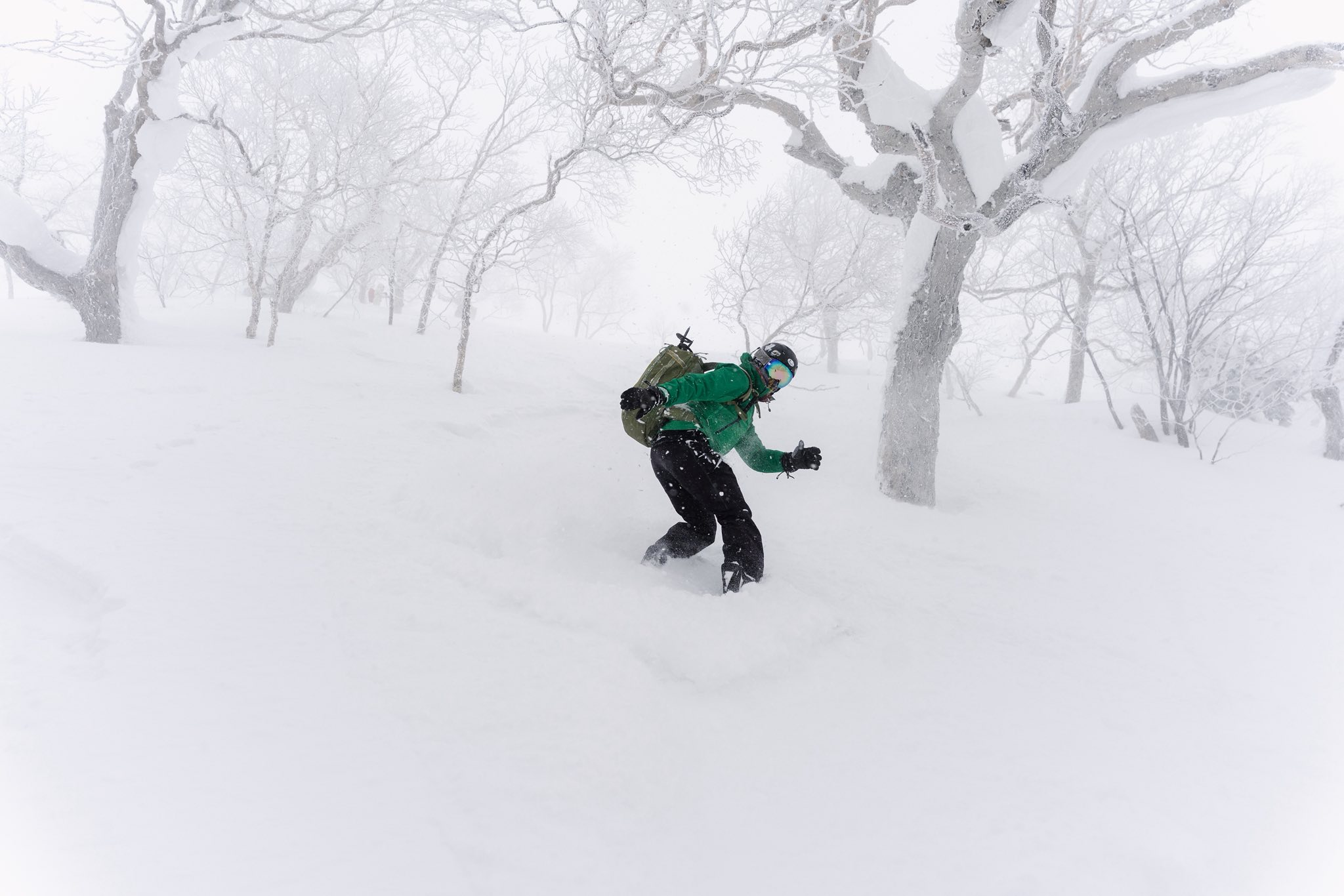 Powder skiing green jacket